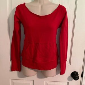 Red ‘cut’ off the shoulder sweater